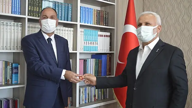 Müftü Topçu, 55 yaşında hafız olan il vaizini misafir etti