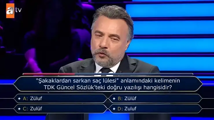 ''Şakaklardan sarkan saç lülesi'' anlamındaki kelimenin TDK Güncel Sözlük'teki doğru yazılışı hangisidir?