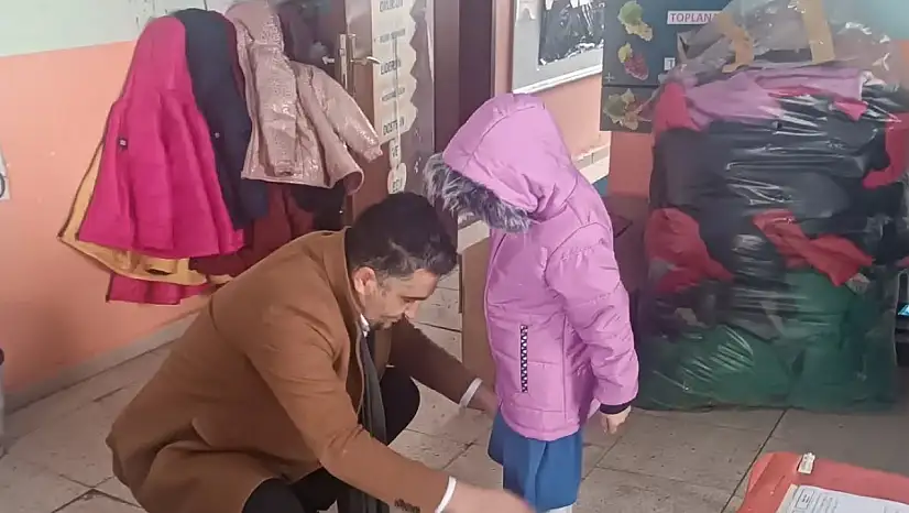 Toklucak ve Budak'ta çocukları ısıtan yardım